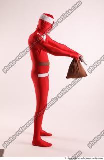 JOEL_ADAMSON CHRISTMAS VALLAIN WITH GUN AND BAG